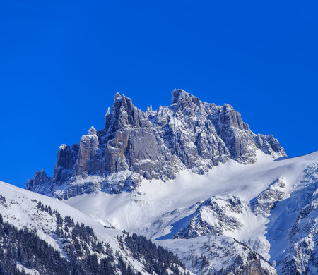 Mt. Gross Spannort in winter, view from the town of Engelberg. The Gross Spannort is a mountain of...