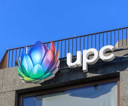 Wallisellen, Switzerland - 28 December, 2016: UPC sign on the top of a building. UPC is the brand of UPC Switzerland LLC, which is the largest broadband cable operator in Switzerland, founded in 1994.のeditorial素材
