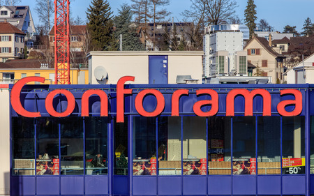 Wallisellen, Switzerland - 28 December, 2016: windows of the Conforama store, buildings of the town in the background. Conforama is Europe's second largest home furnishings retail chain with over 200 stores in France, Spain, Switzerland, Portugal, Luxemboのeditorial素材