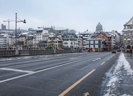 Zurich, Switzerland - 3 January, 2017: view along the Rudolf Brun bridge on an overcast day in winter. Rudolf Brun bridge is a bridge over the Limmat river, named after Rudolf Brun (1290s-1360), who was the leader of the Zurich guild's revolution of 1336,のeditorial素材