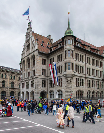 Zurich, Switzerland - 17 April, 2016: participants of children's parade (German: Kinderumzug) devoted to the upcoming Sechselauten festivity at the Zurich City Hall (German: Stadthaus) building. The Sechselauten is a traditional spring holiday in the cityのeditorial素材