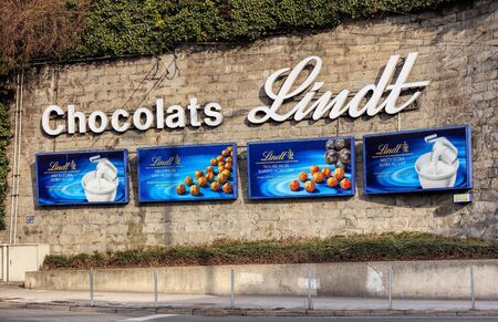 Zurich, Switzerland - 27 January, 2017: advertisement of Chocolats Lindt on a stone wall at Central square. Lindt is a brand of Lindt & Sprungli AG, more commonly known as Lindt - a Swiss confectionery company, founded in 1845.のeditorial素材