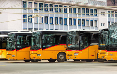 Chur, Switzerland - 3 March, 2017: PostAuto buses at the bus station. PostBus Switzerland (German:...