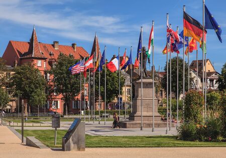 Colmar, France - 18 July, 2014: flags on Place Rapp square. Colmar is the third-largest commune of the Alsace region in north-eastern France, renowned for its well preserved old town, numerous architectural landmarks and museums.のeditorial素材
