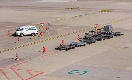 Kloten, Switzerland - 28 March, 2017: a van and carts in the Zurich Airport. The Zurich Airport,...