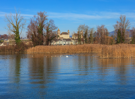 View of the town of Rapperswil in Switzerland from Lake Zurich at the very end of autumn.の写真素材