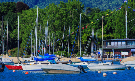 Zurich, Switzerland - 18 June, 2017: boats on Lake Zurich in the city of Zurich. Lake Zurich is a lake in Switzerland, extending southeast of the city of Zurich, which is the largest city in Switzerland.のeditorial素材
