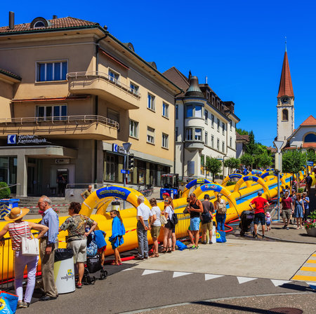 Wallisellen, Switzerland - 18 June, 2017: the Slide my Day event of the Radio Zurisee in the town of Wallisellen in the Swiss canton of Zurich, with a 200 meter long slide installed along Kirchstrasse street.のeditorial素材