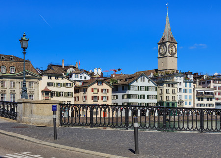 Zurich, Switzerland - 18 June, 2017: old town buildings along the Limmat river, view from Munsterbrucke bridge. Zurich is the largest city in Switzerland and the capital of the Swiss canton of Zurich.のeditorial素材