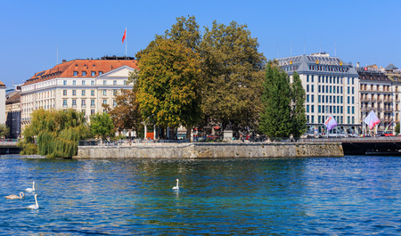 Geneva, Switzerland - 24 September, 2016: the Rhone river and buildings along it in the city of Geneva. The city of Geneva is the capital of the Republic and canton of Geneva, being the second most populous city in Switzerland.のeditorial素材