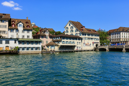 Zurich, Switzerland - 18 June, 2017: the Limmat river and city's old town buildings along it. Zurich is the largest city in Switzerland and the capital of the Swiss canton of Zurich.のeditorial素材