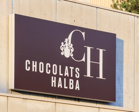 Wallisellen, Switzerland - 3 September, 2017: Chocolats Halba company sign on the wall of their factory building. Chocolats Halba is a Swiss manufacturer of chocolate, headquartered in the town of Wallisellen in the Swiss canton of Zurich, with the secondのeditorial素材
