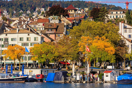 Zurich, Switzerland - 25 September, 2017: embankment of the Limmat river in the city of Zurich in the evening, old town buildings in the background. Zurich is the largest city in Switzerland and the capital of the Swiss canton of Zurich.のeditorial素材
