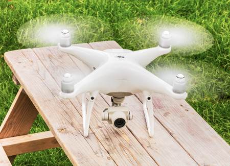 Wallisellen, Switzerland - 19 September, 2017: a Phantom 4 Pro drone standing on a wooden table. Phantom 4 Pro is a consumer drone, designed and manufactured by the DJI company.のeditorial素材