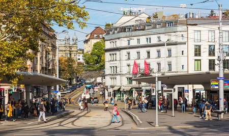Zurich, Switzerland - 29 September, 2017: tram stops, people and buildings on Bellevueplatz square. Bellevueplatz is a town square in Zurich, named after the former Grandhotel Bellevue on its north side, it is one of the nodal points for roads and public のeditorial素材