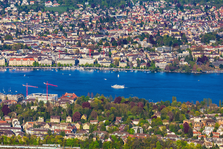 Mt. Uetliberg, Switzerland - 20 April, 2016: Lake Zurich and buildings of the city of Zurich as seen from Mt. Uetliberg. The Uetliberg is a mountain offering a panoramic view of the city of Zurich from its summit.のeditorial素材