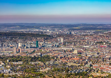 Mt. Uetliberg, Switzerland - 20 April, 2016: buildings of the city of Zurich as seen from Mt. Uetliberg. The Uetliberg is a mountain offering a panoramic view of the city of Zurich from its summit.のeditorial素材