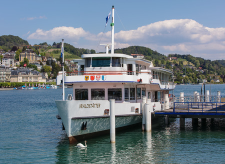 Lucerne, Switzerland - 8 May, 2016: buildings of the city of Lucerne along Lake Lucerne, MS Waldstatter at a pier. Lake Lucerne is a lake in central Switzerland, it is the fourth largest lake in the country.のeditorial素材
