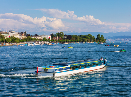 Zurich, Switzerland - May 11, 2018: Lake Zurich, summits of the Alps in the background, view from the city of Zurich. Lake Zurich is a lake in Switzerland, extending southeast of the city of Zurich, which is the largest city in the country and the capitalのeditorial素材