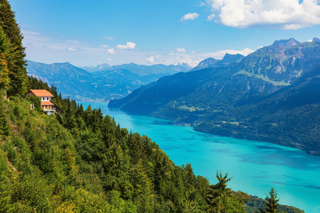 Mt. Harder, Switzerland - August 7, 2018: view from the Harderkulm towards lake Brienzsee, people at the building of the funicular railway station.のeditorial素材