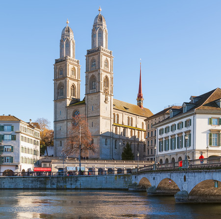The Limmat river and the Grossmunster cathedral in the city of Zurich at the very end of November.の写真素材