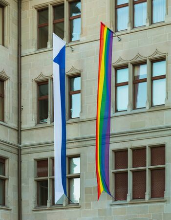 Zurich, Switzerland - June 16, 2019: facade of the Zurich City Hall building decorated with a rainbow flag of the LGBT movement and a flag of Zurich for the Zurich Pride Festival which took place during June 14-15. Zurich City Hall houses the administratiのeditorial素材