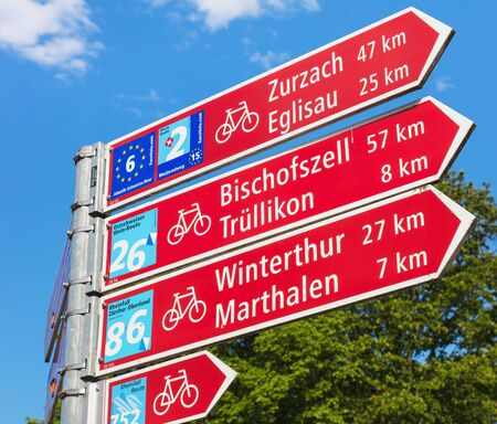 Laufen-Uhwiesen, Switzerland - June 7, 2019: a directional sign showing directions and distances to some of the closest localities. Laufen-Uhwiesen is a municipality in the district of Andelfingen in the Swiss canton of Zurich.のeditorial素材