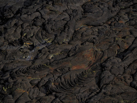 Lava patterns in the Erta Ale volcano area. The lava flow formed incredible waves and patterns after...