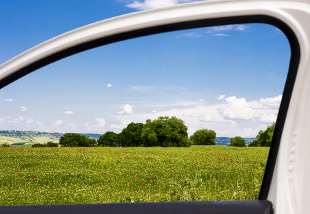 Countryside viewed through a car windowの写真素材