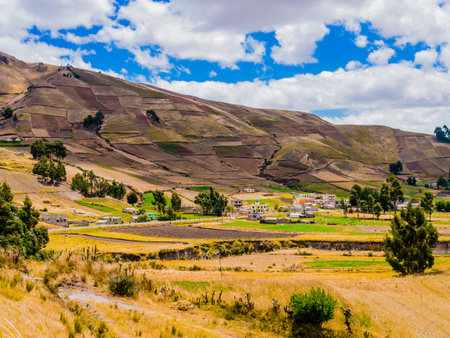 Ecuador, scenic andean landscape between Zumbahua canyon and Quilotoa lagoon with peasant village...