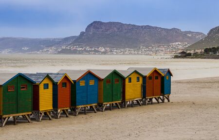 Row of colorful bathing huts in Muizenberg beach, in front of the ocean sea, Cape Town, South Africaの写真素材