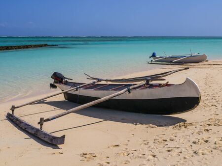 Traditional outrigger pirogue moored on white sand beach, Nosy Ve island, Indian Ocean, Madagascarの写真素材