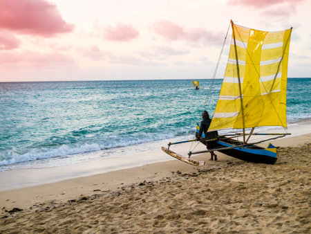 Colored outrigger fishermen pirogue leaves Anakao coast at sunset for a night fishing trip, Indian Ocean, Madagascarの写真素材