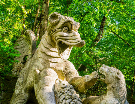 Detail of the winging dragon fighting against three beasts, a huge sculpture at famous Park of the...