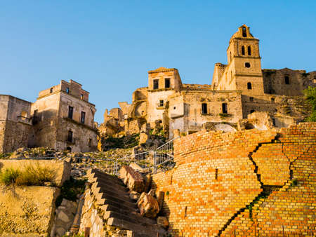 Dramatic view of Craco ruins, ghost town abandoned after a landslide, Basilicata region, southern Italyの写真素材