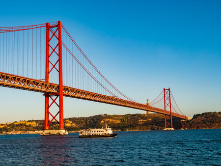 Stunning view of the 25 de Abril (25th April) suspension bridge crossing the Tagus river, Belem...