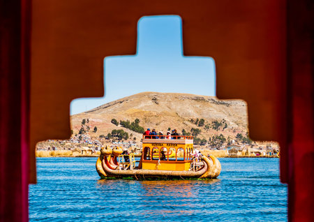 Trip on lake Titicaca with a traditional totora boat, Uros island, Puno, Peru