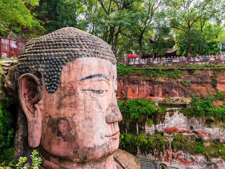 Impressive view of Leshan Giant Buddha, carved directly into the cliff face at the confluence of the Min, Dadu and Qingyi rivers, Sichuan, Chinaの写真素材