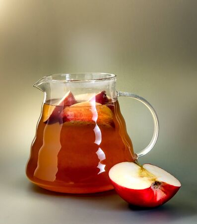 Apple tea in a glass teapotの写真素材
