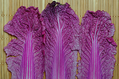 purple chinese cabbage on a bamboo tablecloth, top viewの写真素材
