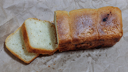 Slices of bread with raisins on a baking paper