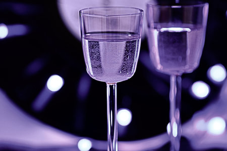 Champagne glasses on a black background. Shallow depth of field.の写真素材