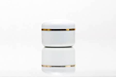 close up of a white unbranded cream jar on white background. cosmetic mock up. branding identity mockup concept.の写真素材