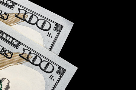 topview of fragment of dollar bills on black velvet, as a backgroundの写真素材