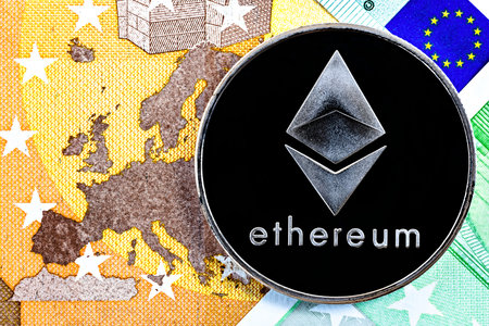 ethereum blockchain cryptocurrency coin on euro bills background