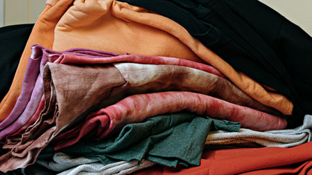 selective focus photo of multicolored textile fabric samples. serigraphy production. printing images on t-shirts by silkscreen method in a design studioの写真素材