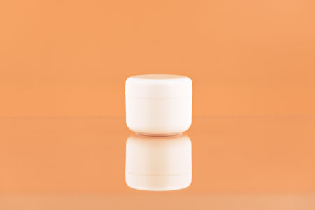 Unbranded plastic jar for cosmetics products. Skincare and cosmetology mockup. Branding identity mockup conceptの写真素材