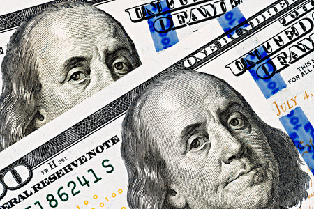 topview of fragment of dollar bills as a backgroundの写真素材