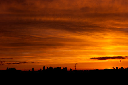 Dramatic sunset over the city, silhouette of a city.の写真素材