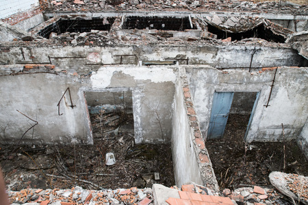 Old destroyed an abandoned multi-storey building in a military town where nobody livesの写真素材